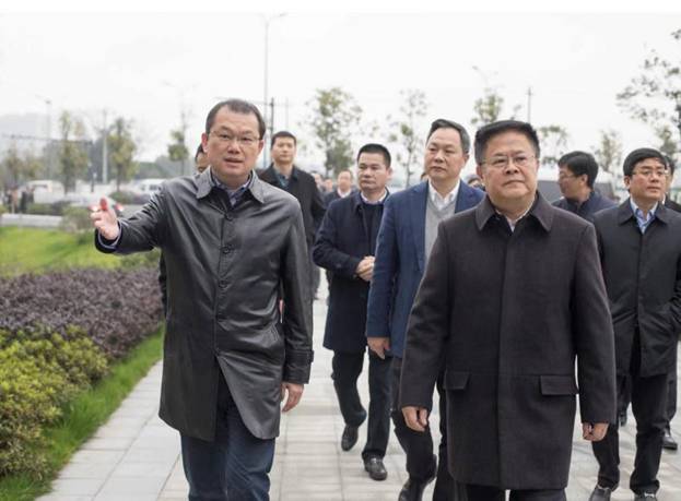 A group of men walking down a sidewalk Description automatically generated with low confidence